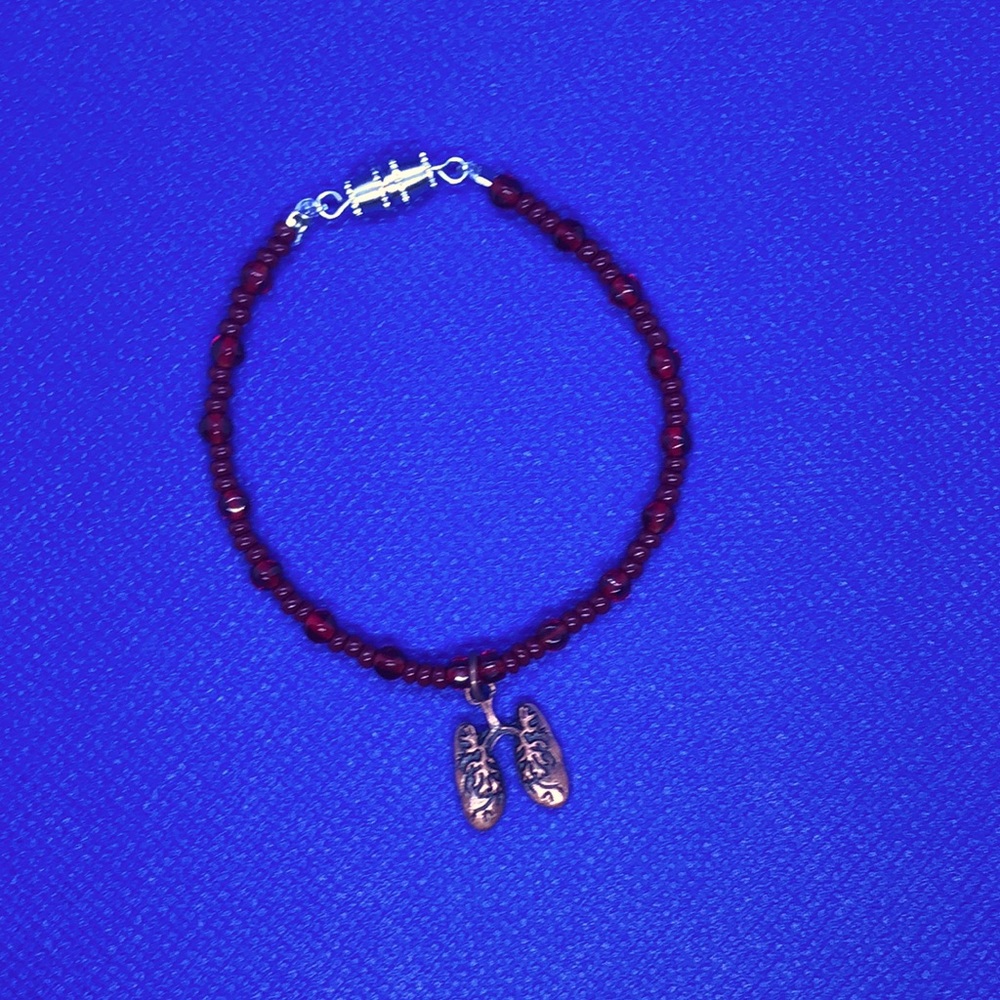 Copper lung charm on a red beaded bracelet (handmade)